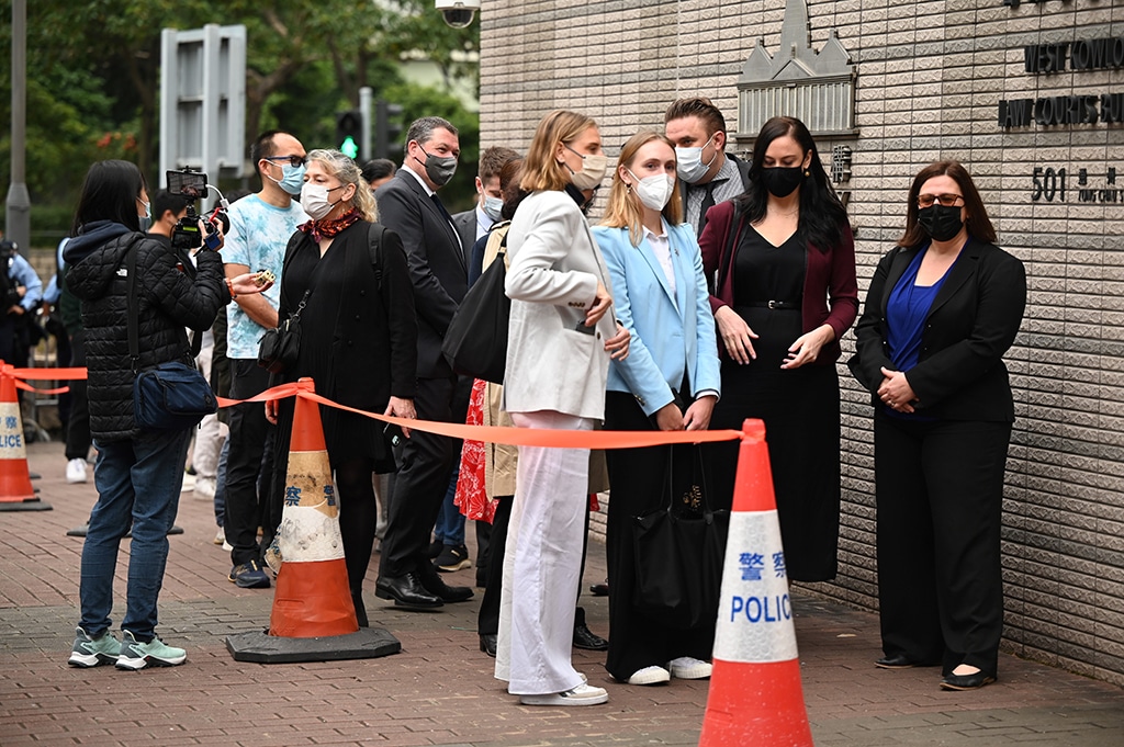 HONG KONG: Foreign diplomats queue outside a court in Hong Kong on February 6, 2023 as they wait to attend the trial of 47 of Hong Kong's most prominent pro-democracy figures which begins in the largest prosecution under a national security law that has crushed dissent in the city. - AFP