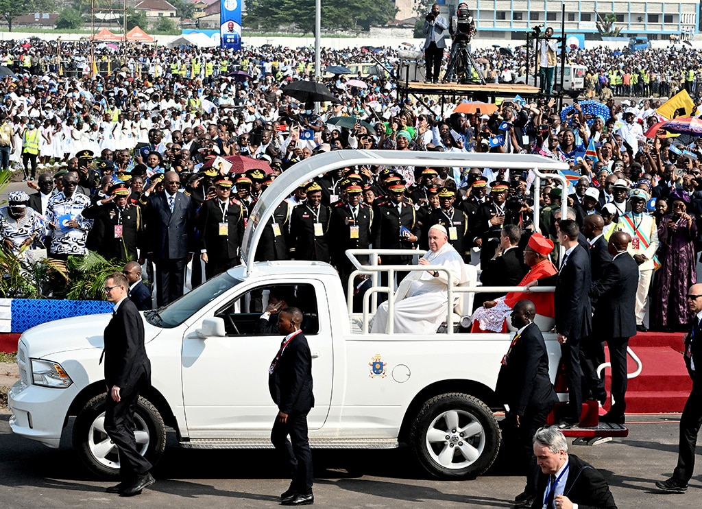 KINSHASA: Pope Francis (C) arrives by popemobile for the mass at the N'Dolo Airport in Kinshasa, Democratic Republic of Congo (DRC), on February 1, 2023. - AFP