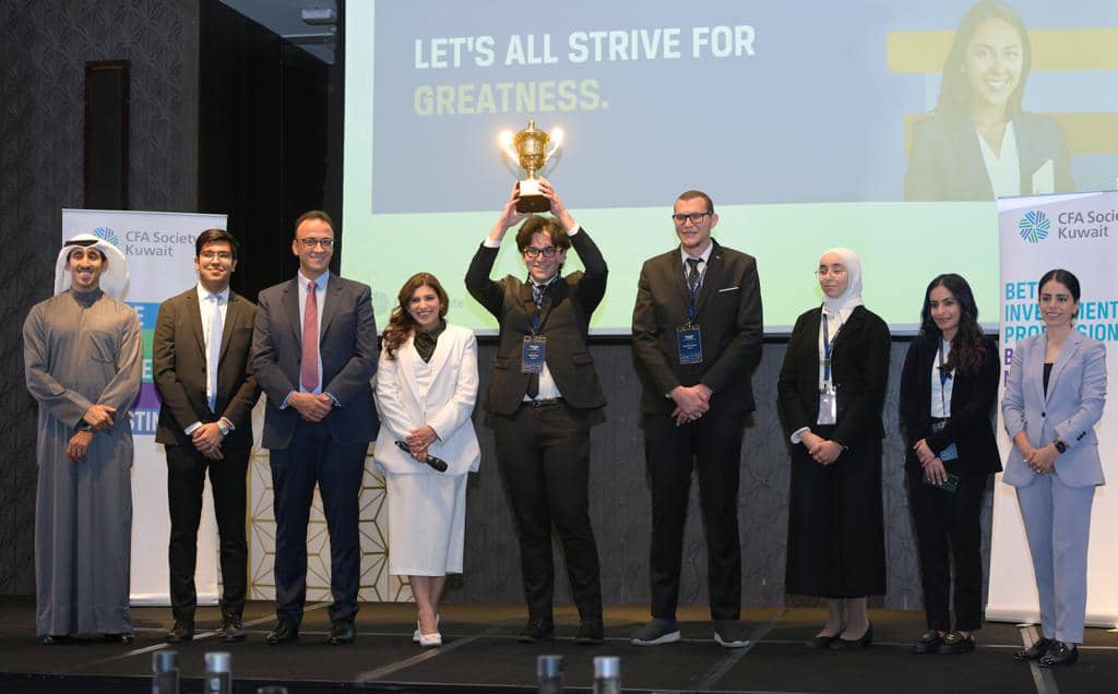Kuwait University students with the winner's trophy.
