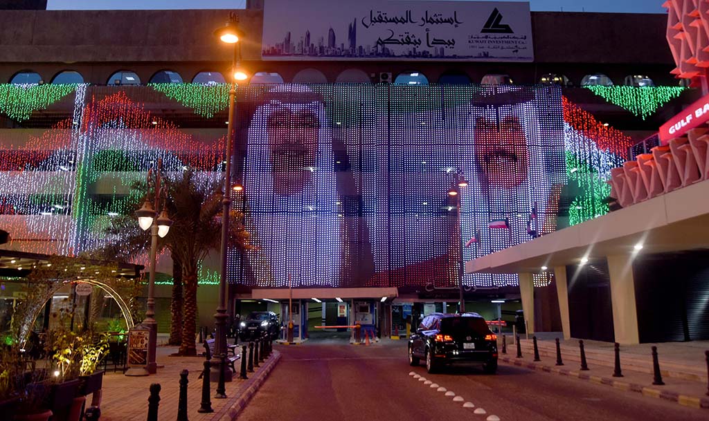 KUWAIT: Portraits of His Highness the Amir Sheikh Nawaf Al-Ahmad Al-Jaber Al-Sabah and His Highness the Crown Prince Sheikh Mishal Al-Ahmad Al-Jaber Al-Sabah are seen on a shopping mall in Kuwait City as Kuwait celebrates National and Liberation Days. - Photo by Fouad Al-Shaikh