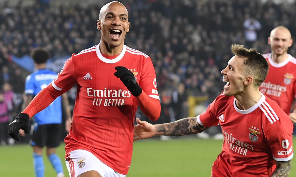 Benfica's Portuguese midfielder Joao Mario (L) celebrates after scoring a goal during the UEFA Champions League round of sixteen first leg football match between Bruges (Club Brugge) and Benfica Lisbon at Jan-Breydel Stadion in Bruges, on February 15, 2023.
