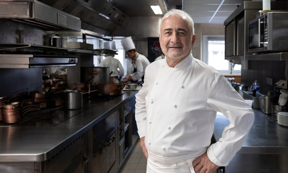 In this file photo taken on November 29, 2022 French chef Guy Savoy poses during a photo session in his restaurant in Paris. French chefs Guy Savoy and Christopher Coutanceau lost a Michelin star, the Michelin guide announced on February 27, 2023.