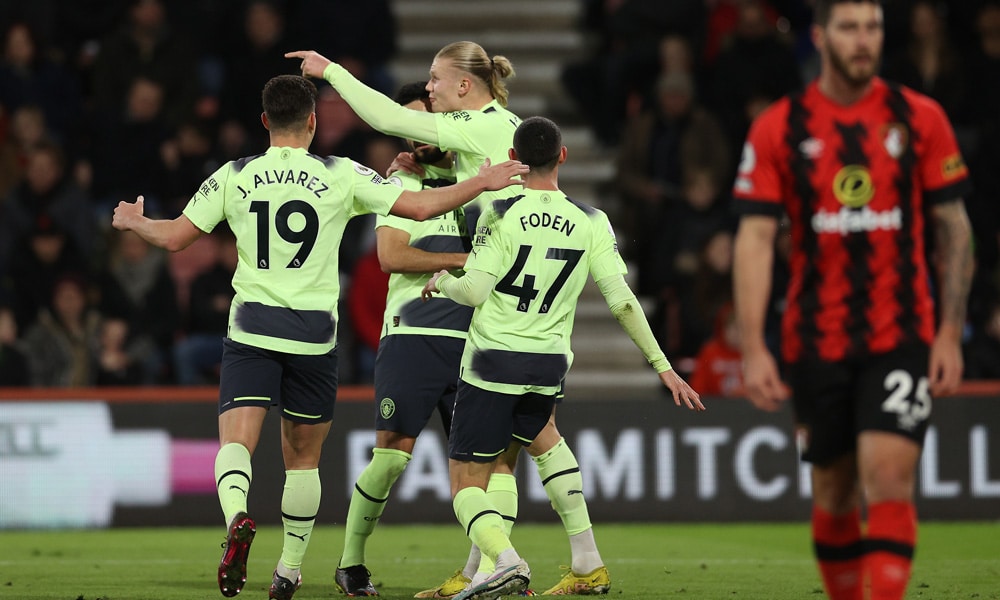 Manchester City's Norwegian striker Erling Haaland celebrates scoring his team's second goal with teammates during the English Premier League football match between Bournemouth and Manchester City at the Vitality Stadium in Bournemouth, southern England on February 25, 2023. 