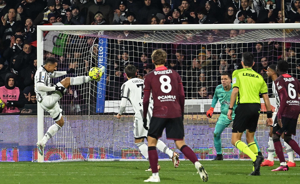 SALERNO: Juventus' Brazilian defender Danilo (left) saves a ball on his goalkeeper's line during the Italian Serie A football match between Salernitana and Juventus on February 7, 2023.- AFP