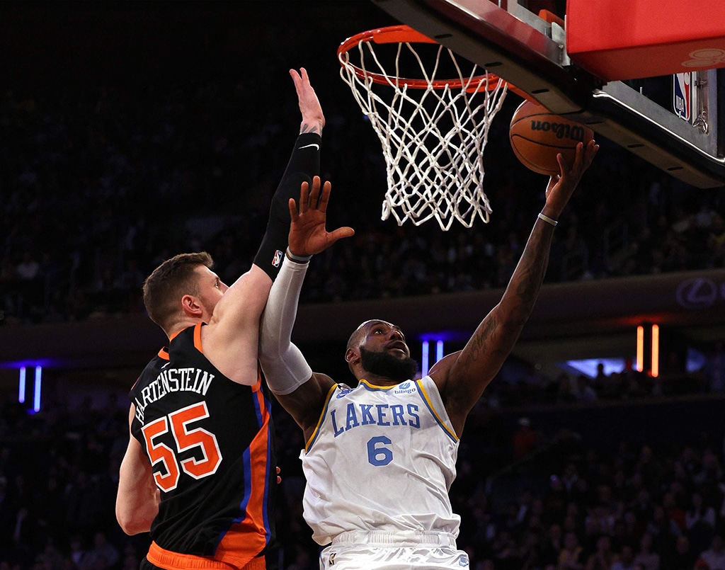 NEW YORK: LeBron James of the Los Angeles Lakers heads for the net as Isaiah Hartenstein of the New York Knicks defends at Madison Square Garden on Jan 31, 2023. - AFP