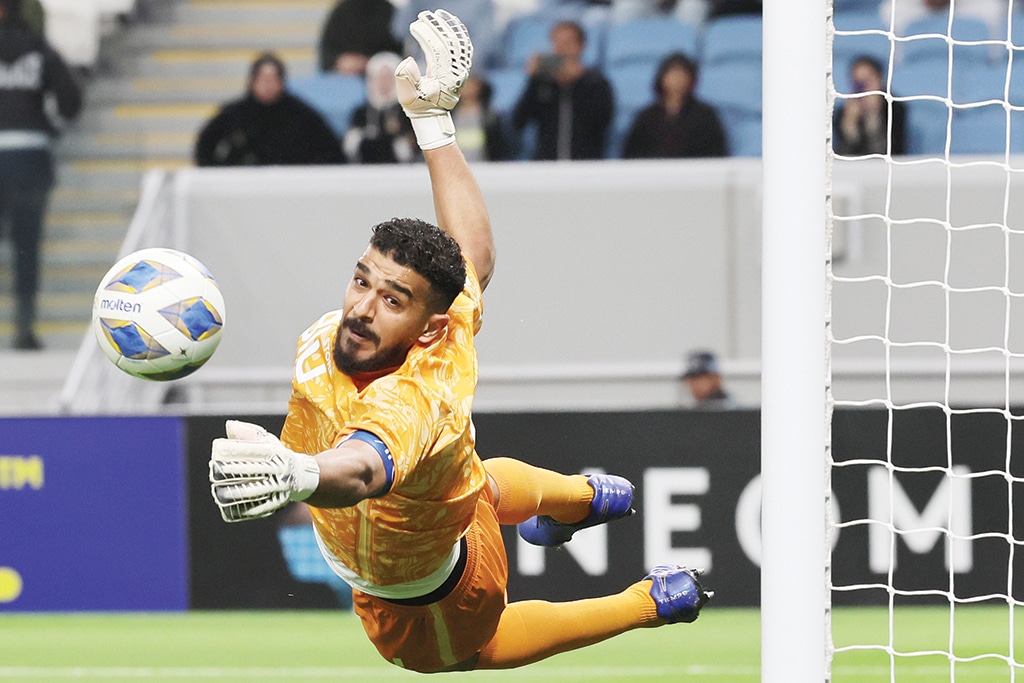 AL-WAKRAH: Hilal's Saudi goalkeeper Abdullah Al-Mayouf watches the ball fly away from his goal during the AFC Champions League round of 16 match between Saudi Arabia's Al-Hilal and UAE's Shabab Al-Ahli on February 20, 2023. - AFP