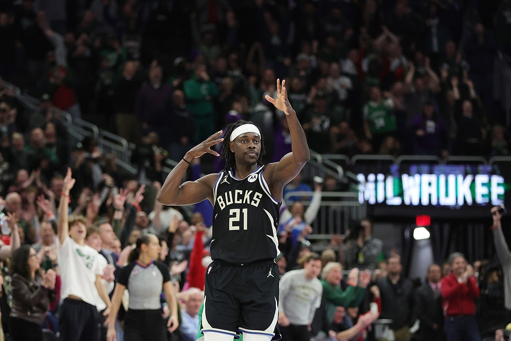 MILWAUKEE: Jrue Holiday #21 of the Milwaukee Bucks reacts to a three point shot in overtime against the Boston Celtics on February 14, 2023.- AFP