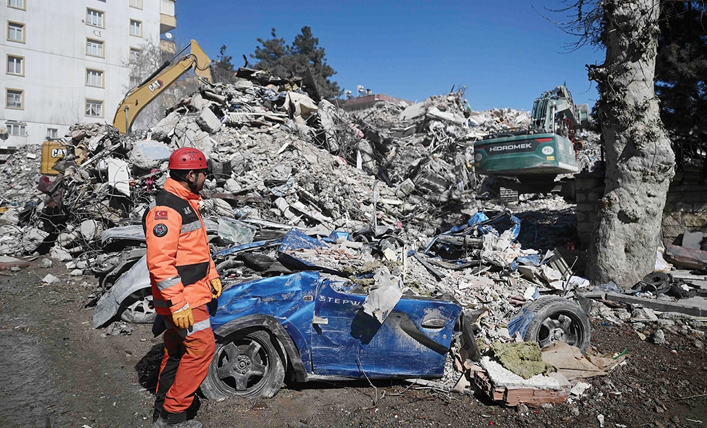 KAHRAMANMARAS, Turkey: A rescuer stands in front of rubble near the site where Aleyna Olmez, 17, was rescued from a collapsed building, 248 hours after a 7.8-magnitude earthquake struck parts of Turkey and Syria on Feb 16, 2023. — AFP