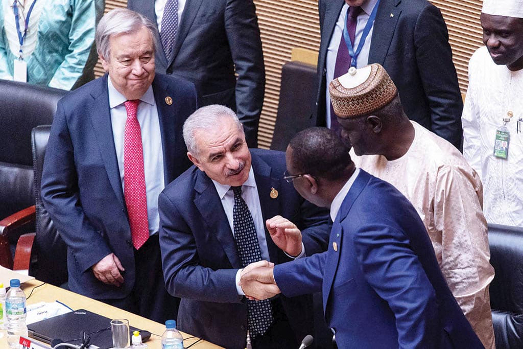 ADDIS ABABA: Palestinian Prime Minister Mohammad Shtayyeh shakes hands with AU Chairperson and Senegalese President Macky Sall as AU Union Commission Chairperson Moussa Faki and UN Secretary General Antonio Guterres look on on Feb 18, 2023. - AFP