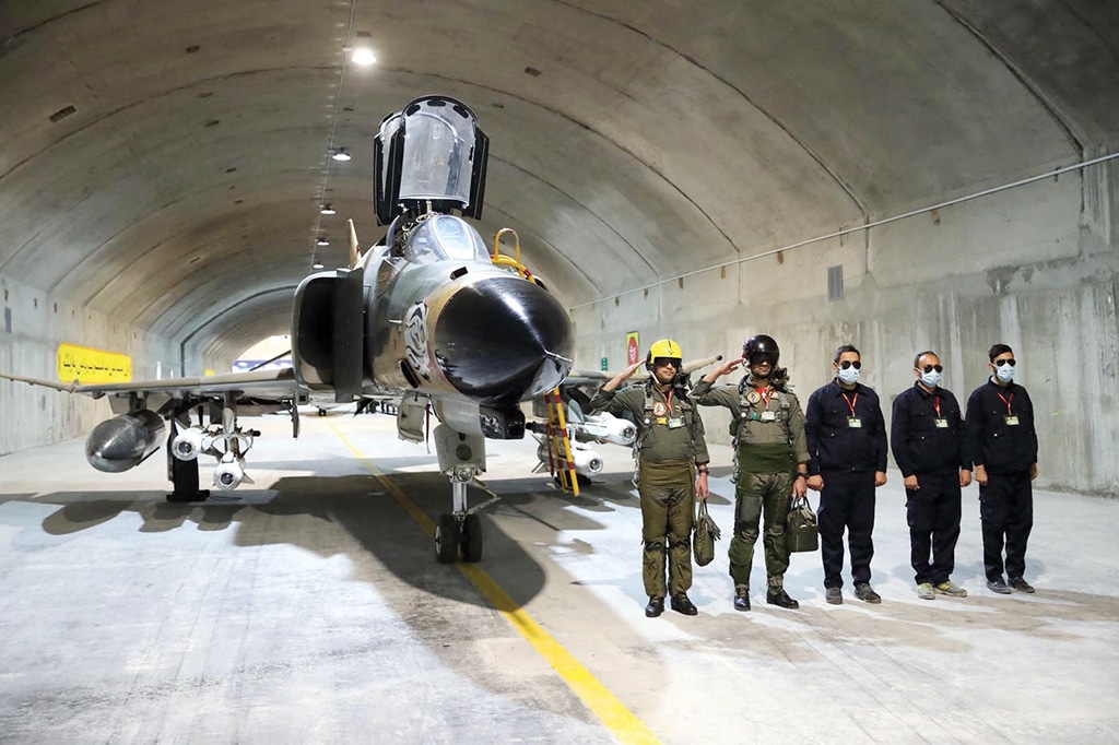 Iran army pilots attend the unveiling of Iran's first underground military base for fighter jets in an undisclosed location. - AFP