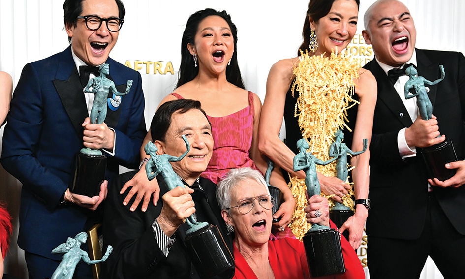 Some of the cast of “Everything Everywhere All at Once” pose with the SAG award for Outstanding Performance by a Cast in a Motion Picture. — AFP photos