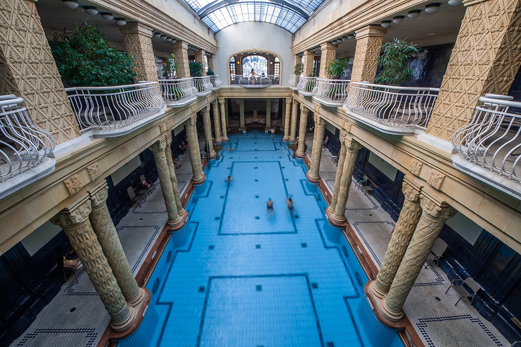 Tourists and guests swim in the water of the Gellert Spa. - AFP photos