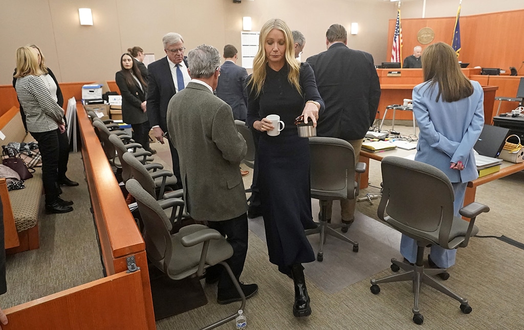 US actress Gwyneth Paltrow carries two beverages as she walks past the man suing her after testifying in court during her trial, in Park City, Utah. — AFP photos
