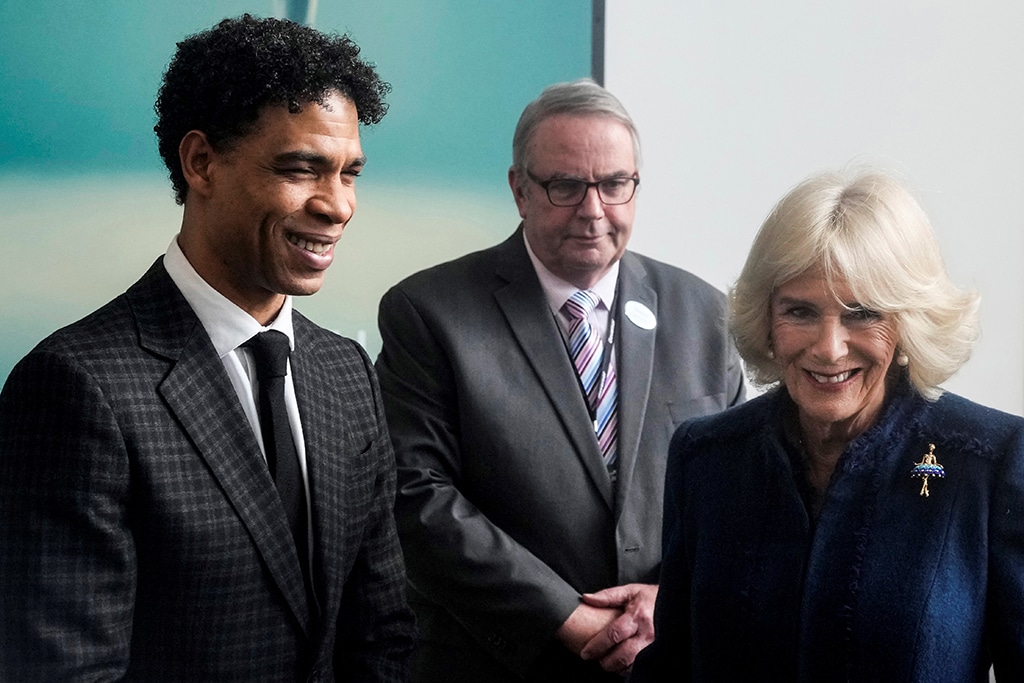 Britain's Camilla, Queen Consort (right) meets with Elmhurst Ballet School's Vice President Carlos Acosta, as she arrives to visit the institution to celebrate the school's centenary, in Birmingham.- AFP