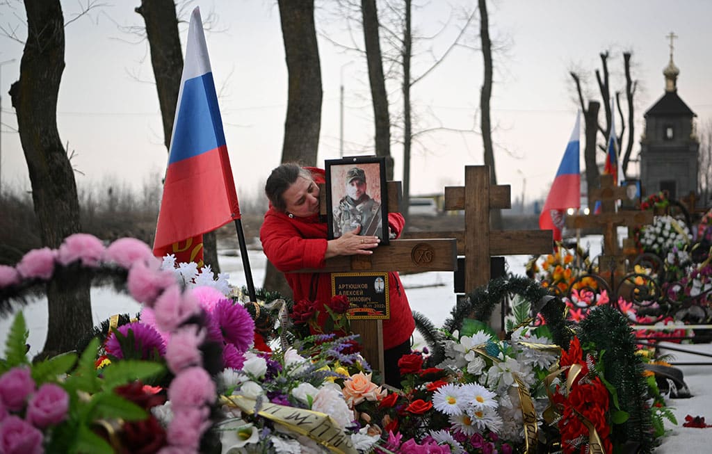 YEFREMOV, Russia: A woman grieves at the grave of her son, a fallen Russian soldier, at a cemetery in the town of Yefremov in the Tula region on March 23, 2023. – AFP