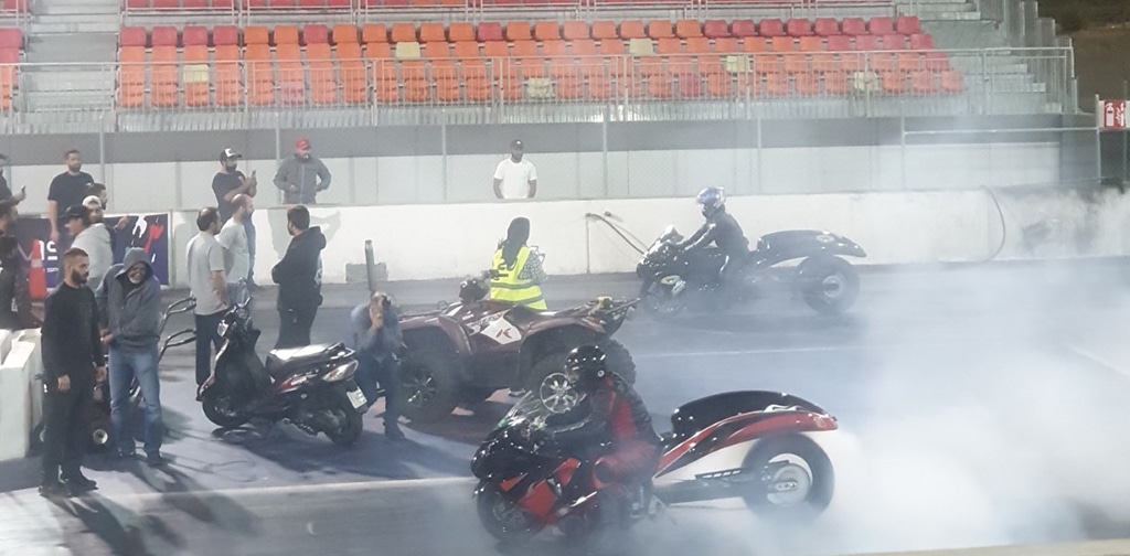 Super Stock series bikes warming-up tires before staging for the drag race. - KUNA photos