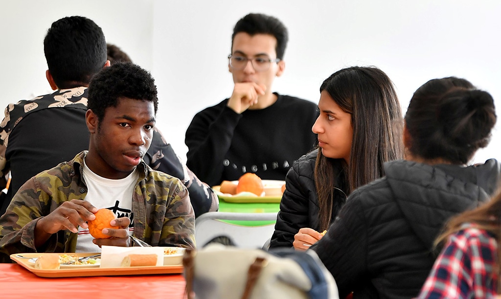 TUNIS: African and Tunisian students sit at the cafeteria in the campus of ESPRIT university, specialised in engineering and management courses, on March 13, 2023 in Tunis. Thousands of sub-Saharan African students in Tunisia are seeking safety assurances from authorities in the aftermath of a spate of racist attacks. - AFP