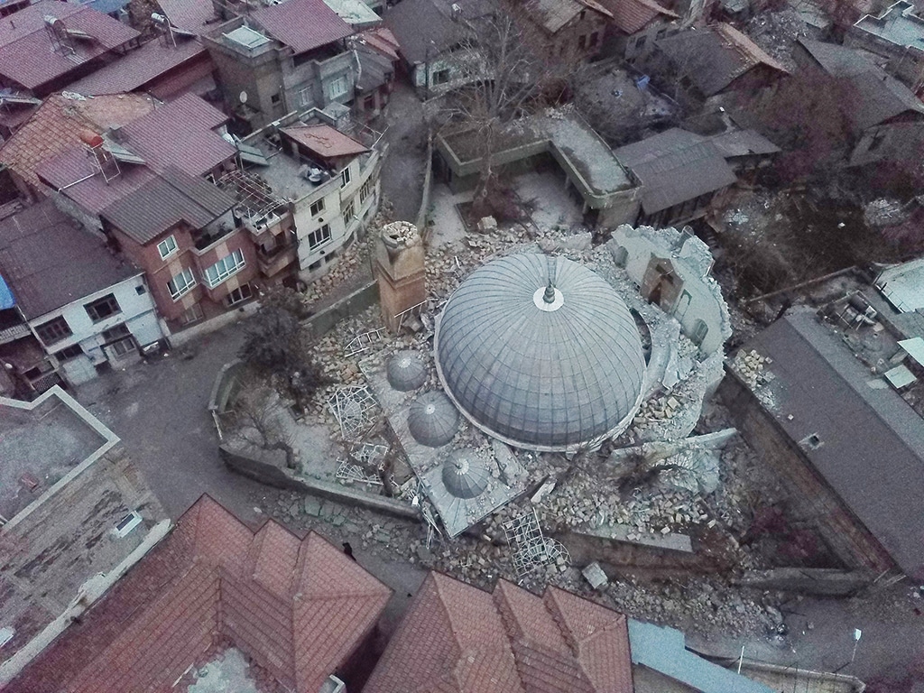KAHRAMANMARAS: An aerial view taken in the evening of on March 5, 2023 shows a destroyed mosque in Kahramanmaras, one month after a massive earthquake struck south-east Turkey. - AFP