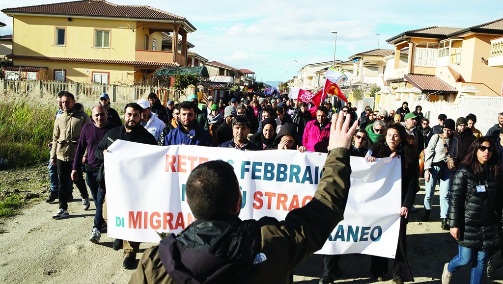 STECCATO DI CUTRO: Relatives of victims (Front) of the February 26, 2023 shipwreck take part in a protest march in Steccato di, Cutro, Calabria region, southern Italy, as part of the movement 'Stop the massacre, now!' - AFP