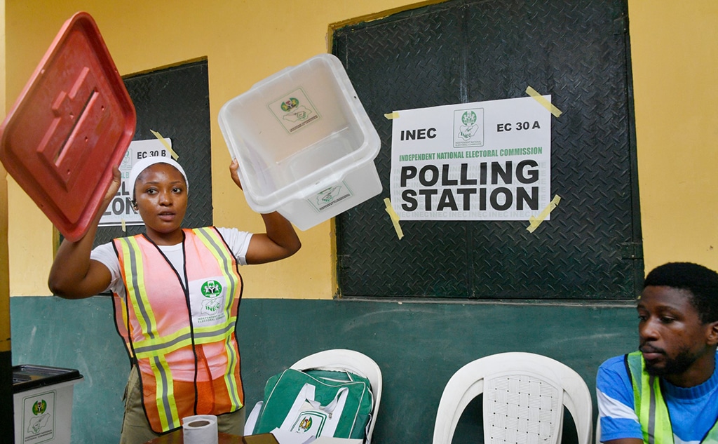 LAGOS: An electoral officicial displays an empty ballot box to party agents before voting begins at a polling station for a gubernatorial and House of Assembly candidates during local elections, in Lagos. - AFP