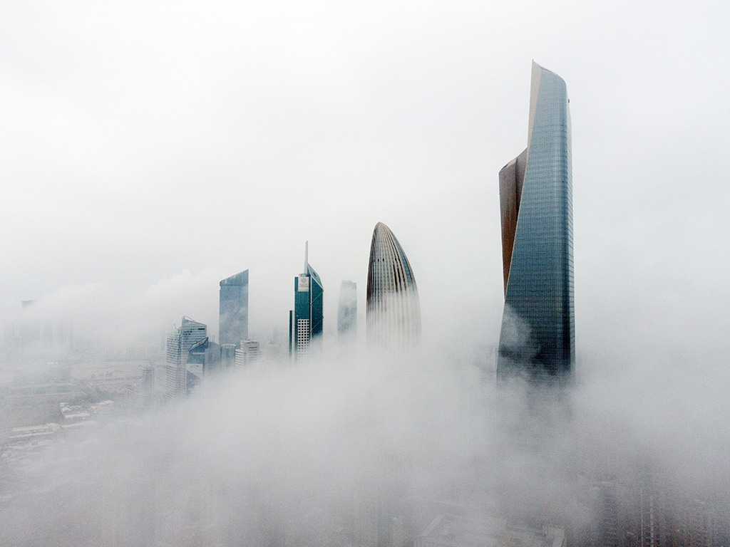 KUWAIT: This aerial picture shows high-rise buildings during a foggy morning in Kuwait City on March 14, 2023. - Photo by Yasser Al-Zayyat