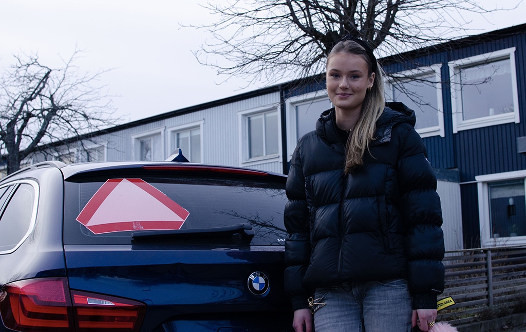 HUDDINGE, Sweden: Picture taken on February 10, 2023 shows Evelina Christiansen, 15, posing next to a car in Huddinge, Sweden. - AFP
