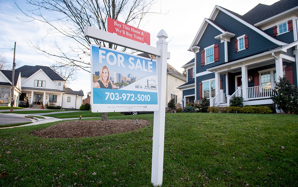 ARLINGTON, US: In this file photo taken on November 21, 2020 a house's real estate for sale sign is seen in front of a home in Arlington, Virginia. – AFP