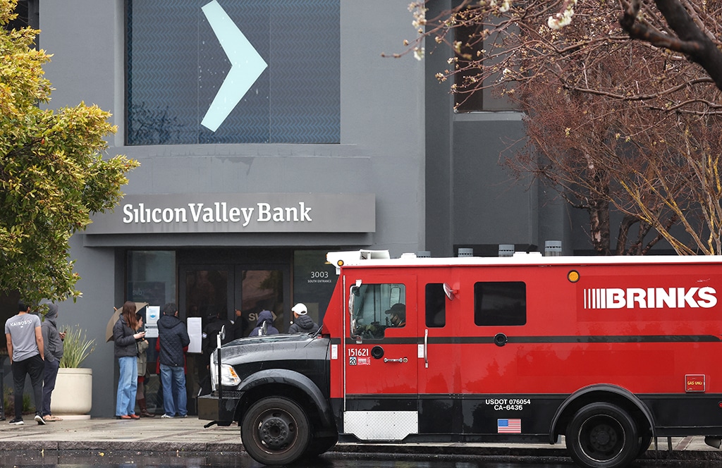 SANTA CLARA, US:  A Brinks armored truck sits parked in front of the shuttered Silicon Valley Bank (SVB) headquarters in Santa Clara, California. - AFP