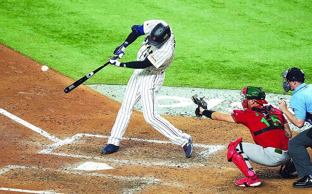 MIAMI: Shohei Ohtani #16 of Team Japan hits a single against Team Mexico during the sixth inning in the World Baseball Classic Semifinals on March 20, 2023.- AFP
