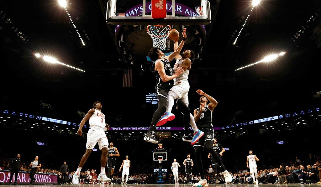 NEW YORK: Donovan Mitchell of the Cleveland Cavaliers dunks against Yuta Watanabe of the Brooklyn Nets during their game at Barclays Center on March 21, 2023. – AFP