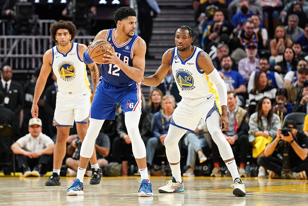 SAN FRANCISCO: Tobias Harris of the Philadelphia 76ers dribbles with the ball in the third quarter against Jonathan Kuminga of the Golden State Warriors at Chase Center on March 24, 2023. – AFP