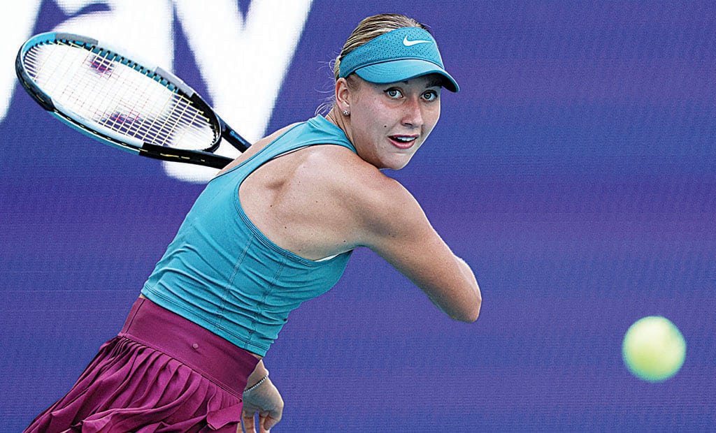 MIAMI GARDENS: Anastasia Potapova plays a backhand against Coco Gauff of the United States in their second round match at Hard Rock Stadium on March 25, 2023.- AFP