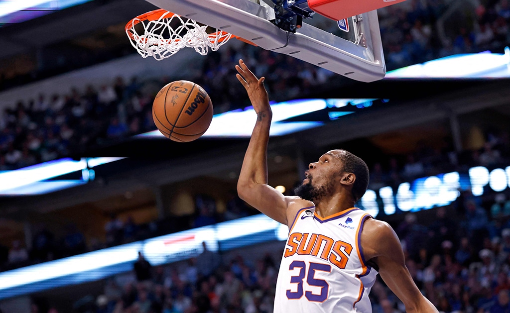 DALLAS: Kevin Durant #35 of the Phoenix Suns slam dunks in the second half of the game against the Dallas Mavericks at American Airlines Center on March 5, 2023.- AFP
