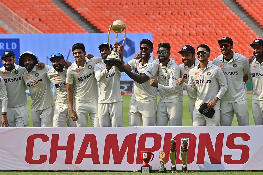 AHMEDABAD: India’s players pose with the trophy after winning the series at the end of the fourth and final Test cricket match between India and Australia at the Narendra Modi Stadium on March 13, 2023. - AFP