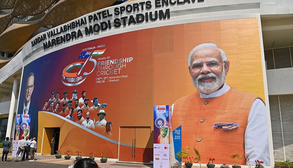 AHMEDABAD: A large banner with pictures of Indian Prime Minister Narendra Modi and Australia's Prime Minister Anthony Albanese is displayed on the facade of Narendra Modi stadium in Ahmedabad on March 8, 2023, ahead of Albanese's visit to India and the fourth and final Test cricket match between India and Australia. - AFP
