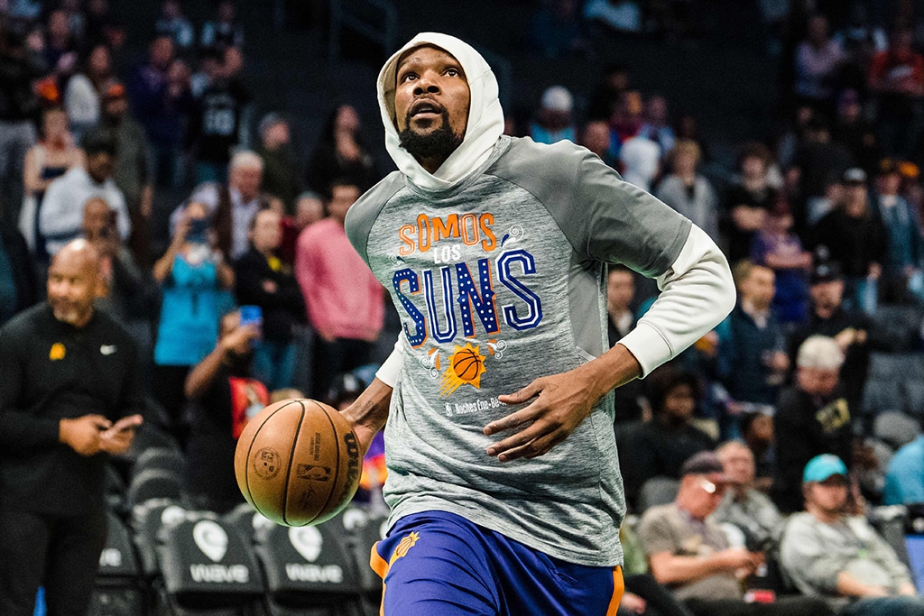 CHARLOTTE: Kevin Durant #35 of the Phoenix Suns warms up before their game against the Charlotte Hornets at Spectrum Center on March 01, 2023.- AFP