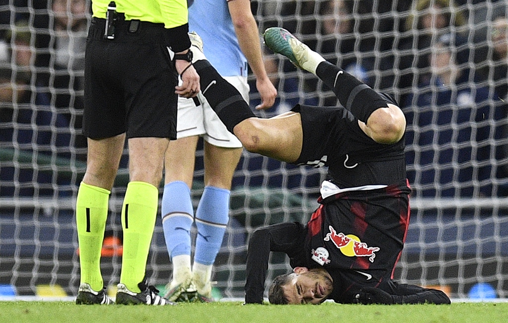 MANCHESTER: Leipzig's Portuguese striker Andre Silva falls to the ground after taking a shot during the UEFA Champions League round of 16 second-leg football match between Manchester City and RB Leipzig on March 14, 2023.- AFP