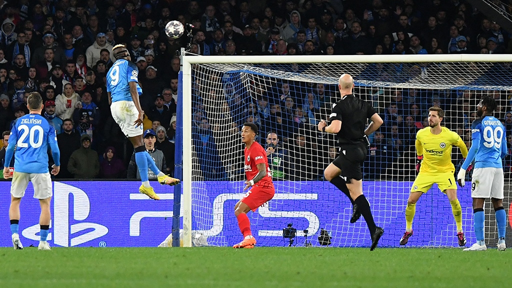 NAPLES: Napoli's Nigerian forward Victor Osimhen (2nd left) shoots a header to open the scoring during the UEFA Champions League round of 16, second leg football match between SSC Napoli and Eintracht Frankfurt on March 15, 2023. - AFP