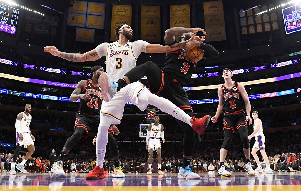 LOS ANGELES: Andre Drummond #3 of the Chicago Bulls pulls down a rebound against Anthony Davis #3 of the Los Angeles Lakers during the first half at Crypto.com Arena on March 26, 2023.- AFP