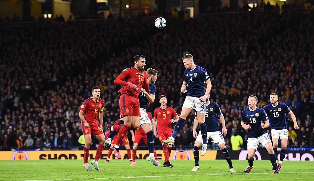 GLASGOW: Scotland’s midfielder Scott McTominay (center right) clears the ball from the path of Spain’s striker Borja Iglesias during the UEFA Euro 2024 group A qualification football match between Scotland and Spain on March 28, 2023. — AFP