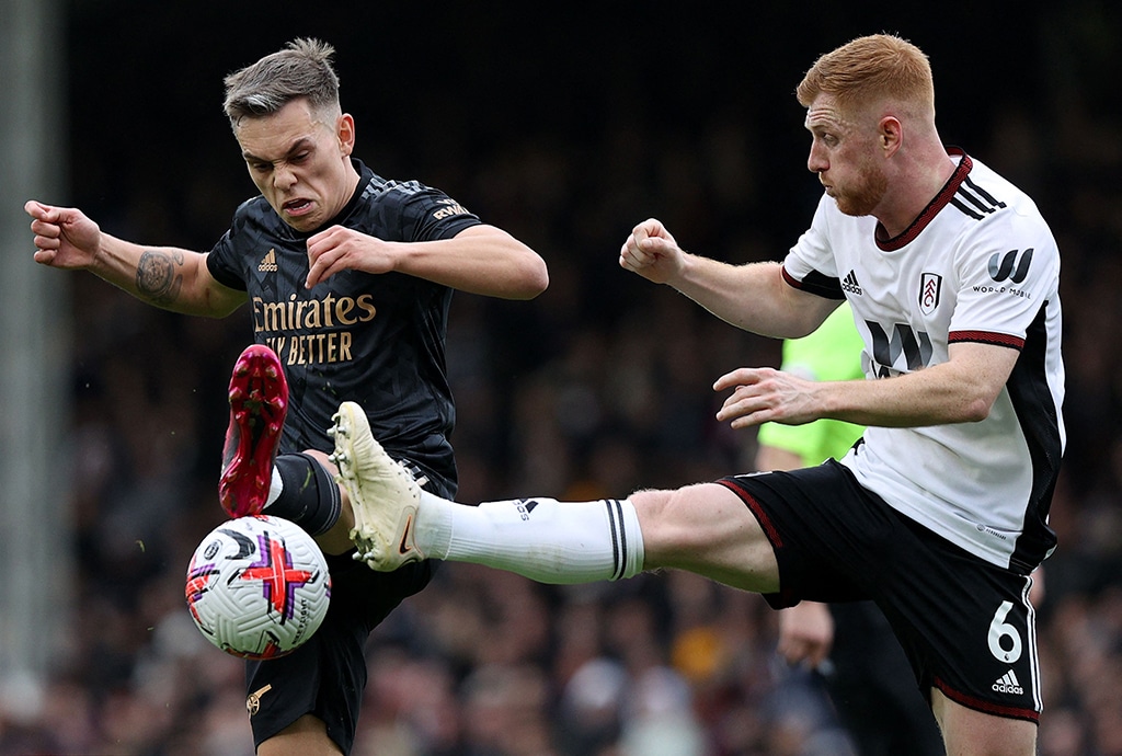 LONDON: Fulham’s English midfielder Harrison Reed (right) vies with Arsenal’s Belgian midfielder Leandro Trossard during the English Premier League football match between Fulham and Arsenal on March 12, 2023. – AFP