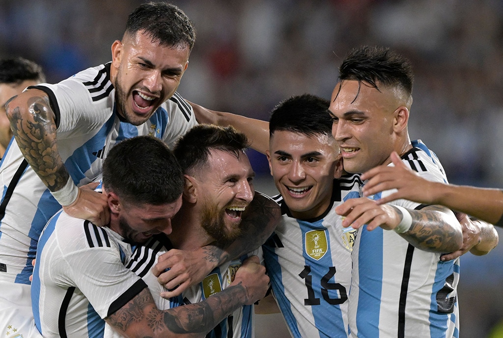 BUENOS AIRES: Argentina’s forward Lionel Messi celebrates with midfielders Leandro Paredes, Rodrigo DenPaul and Thiago Almada and forward Lautaro Martinez after scoring a goal during a friendly match againstnPanama at the Monumental stadium on March 23, 2023. — AFP