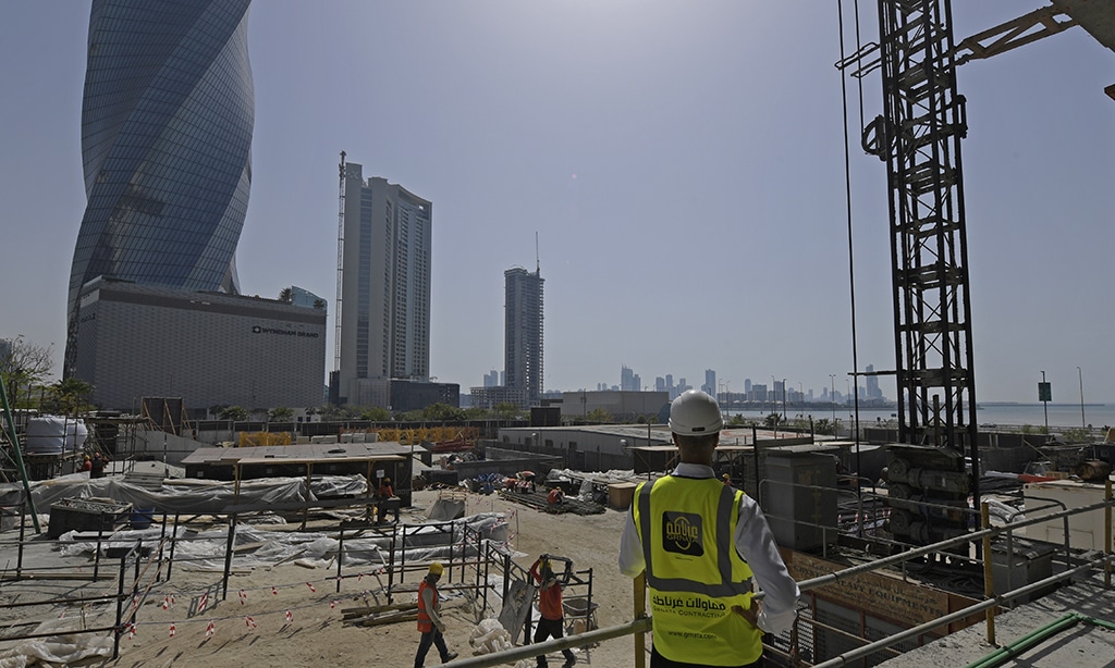 MANAMA: Workers work on the construction site of the Golden Gate towers at Bahrain Bay on March 25, 2023. — AFP