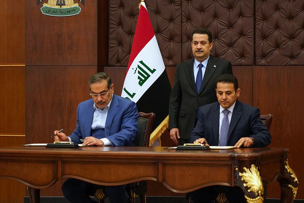 BAGHDAD: Iraqi Prime Minister Mohammed Shia Al-Sudani attends a signing ceremony for a security agreement between the Secretary of Iran's Supreme National Security Council Ali Shamkhani and Iraq's National Security Advisor Qasim Al-Araji on March 19, 2023. - AFP