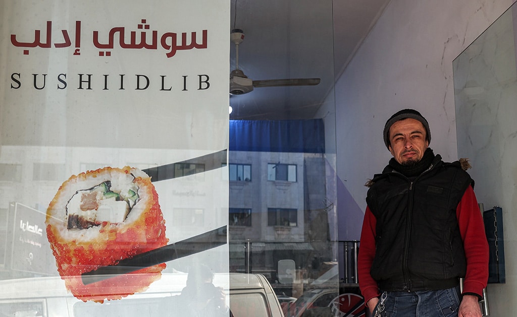 IDLIB: In this picture taken on Jan 29, 2023, Islam Shakhbanov, a fighter from Russia's Dagestan republic, stands at the entrance of his sushi restaurant. - AFP