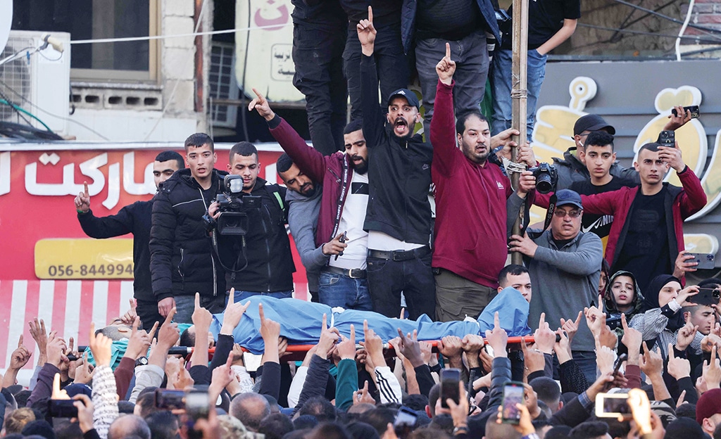 JENIN: Mourners react during the funeral of Palestinians killed in a Zionist raid on March 16, 2023. - AFP