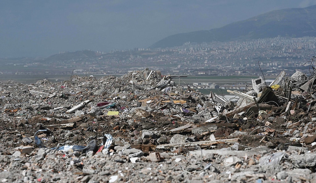 KAHRAMANMARAS: A photo shows debris from collapsed buildings dumped on top of a hill in Kahramanmaras, one month after a massive earthquake struck south-east Turkey. - AFP