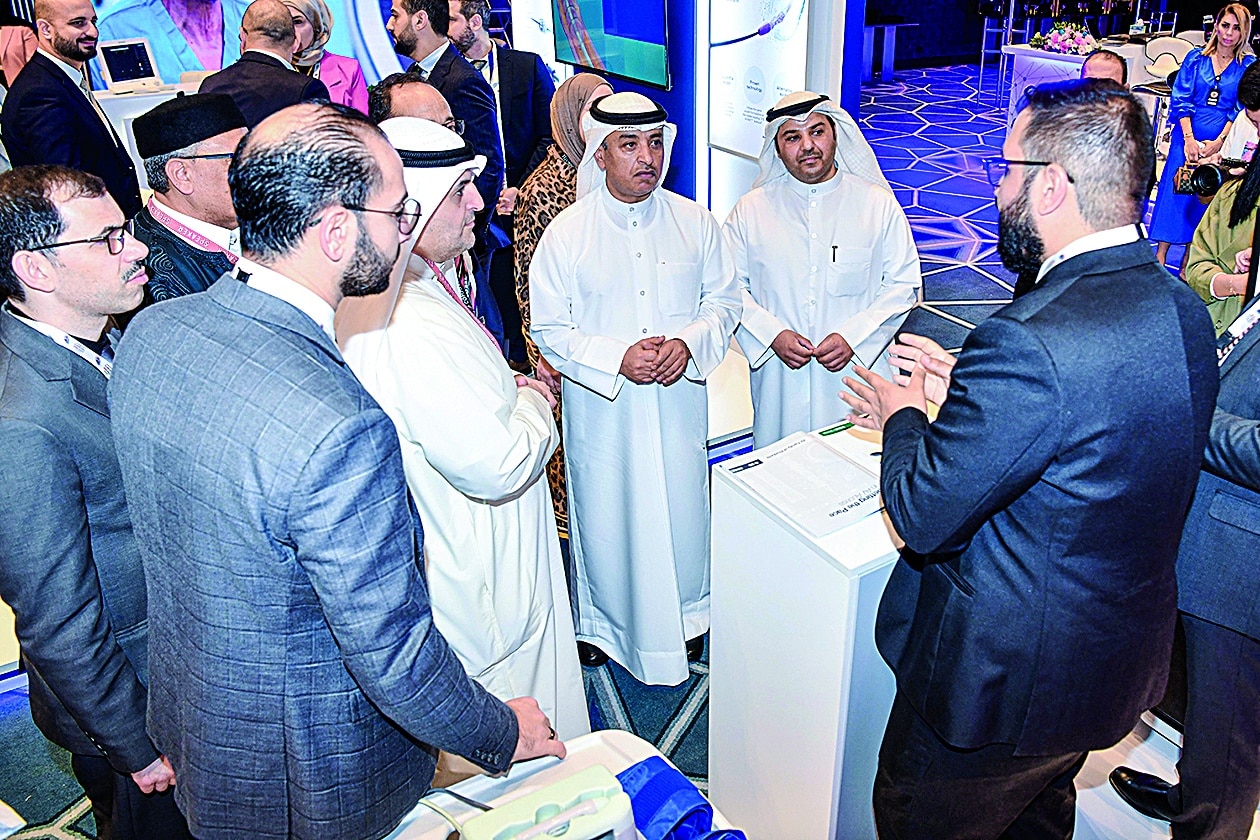 KUWAIT: Participants chat during the opening of the first vascular surgery conference. — KUNA