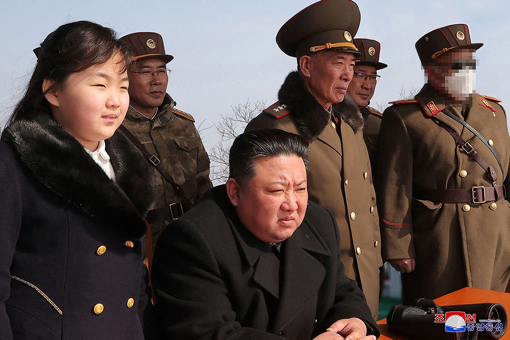 CHOSAN: Picture released by North Korea's official Korean Central News Agency (KCNA) on March 20, 2023 shows North Korea's leader Kim Jong Un (C) and his daughter (L) observing a warhead missile launch exercise simulating a tactical nuclear attack in Cheolsan county, North Pyongan Province. - AFP