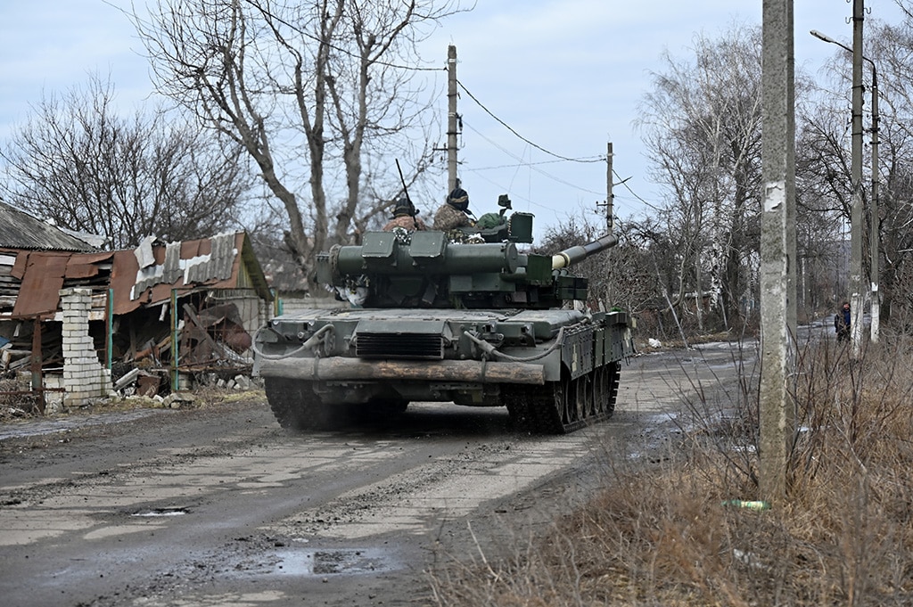 KHARKIV: A Ukrainian tank drives through a village in Kharkiv region, amid the Russian invasion of Ukraine. – AFP